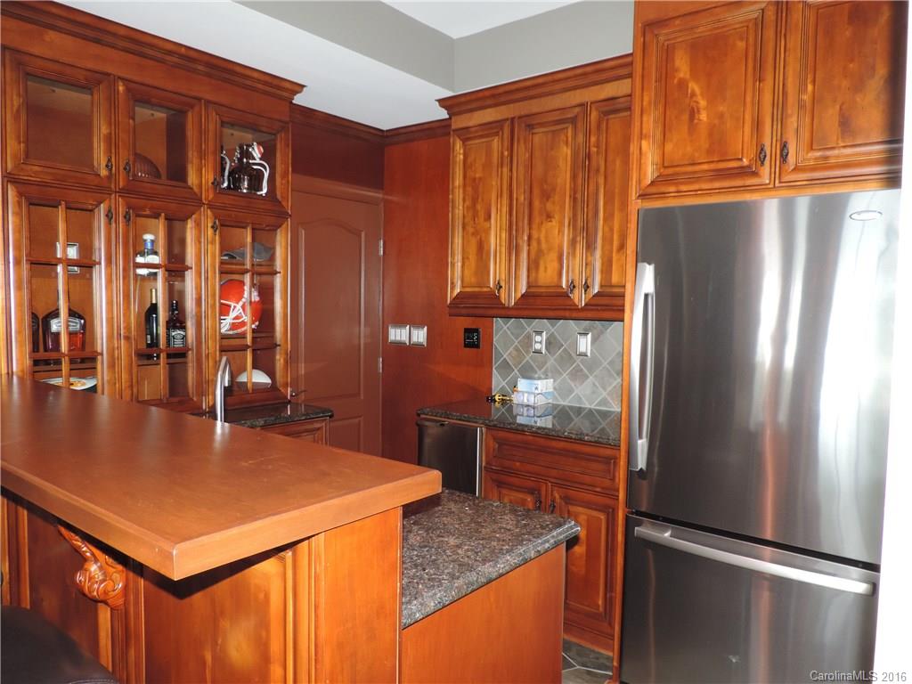 5516 Plantation Ridge Road Charlotte, NC 28214 - Photo 16 of 24 a kitchen with stainless steel appliances granite countertop a refrigerator a sink and a stove