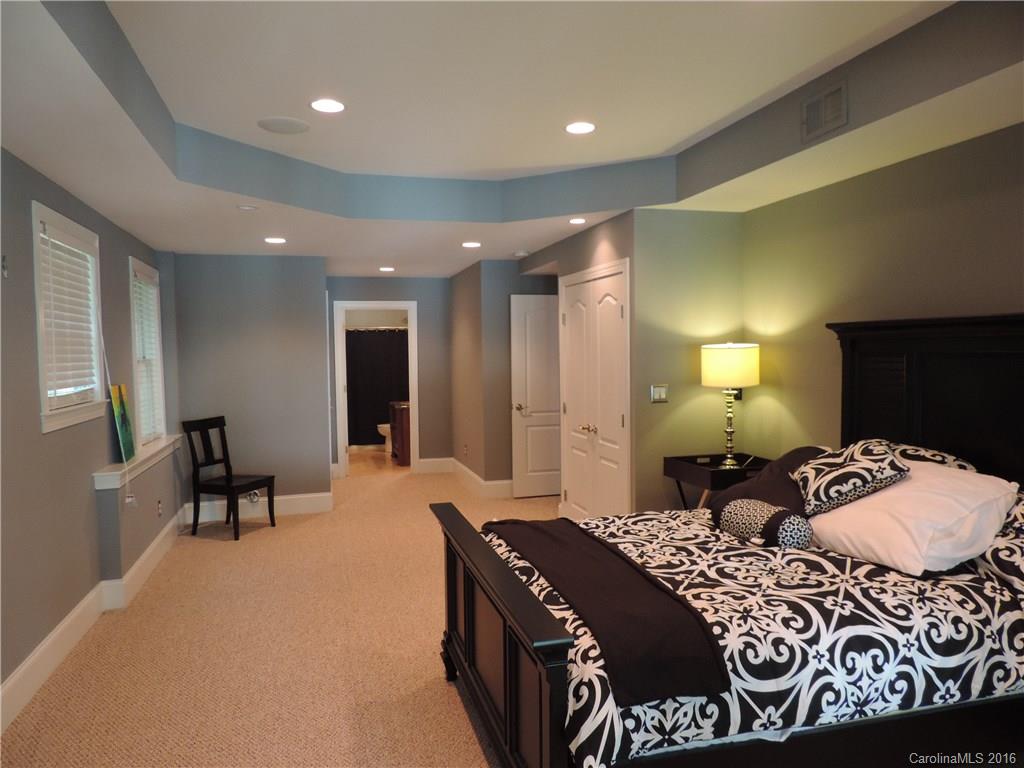 5516 Plantation Ridge Road Charlotte, NC 28214 - Photo 24 of 24 a bedroom with a bed and a mirror