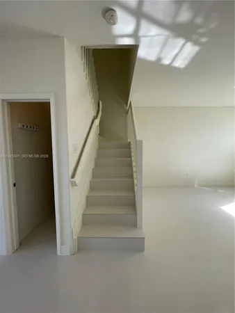 a bathroom with a glass door shower