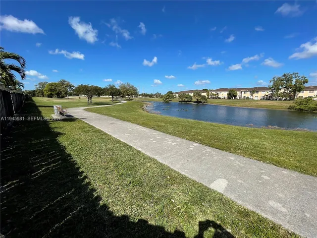 a view of a golf course with a lake