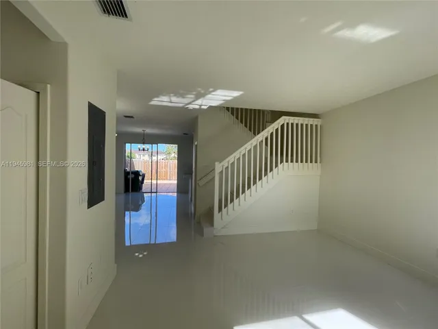 a view of a hallway with entryway