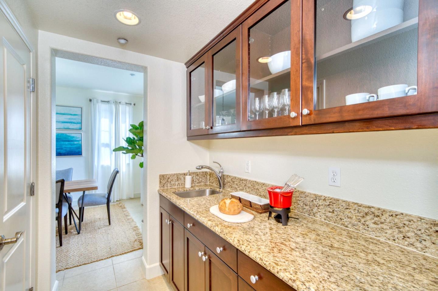 1 Connemara Drive Pacifica, CA 94044 - Photo 14 of 45 a kitchen with a sink and cabinets