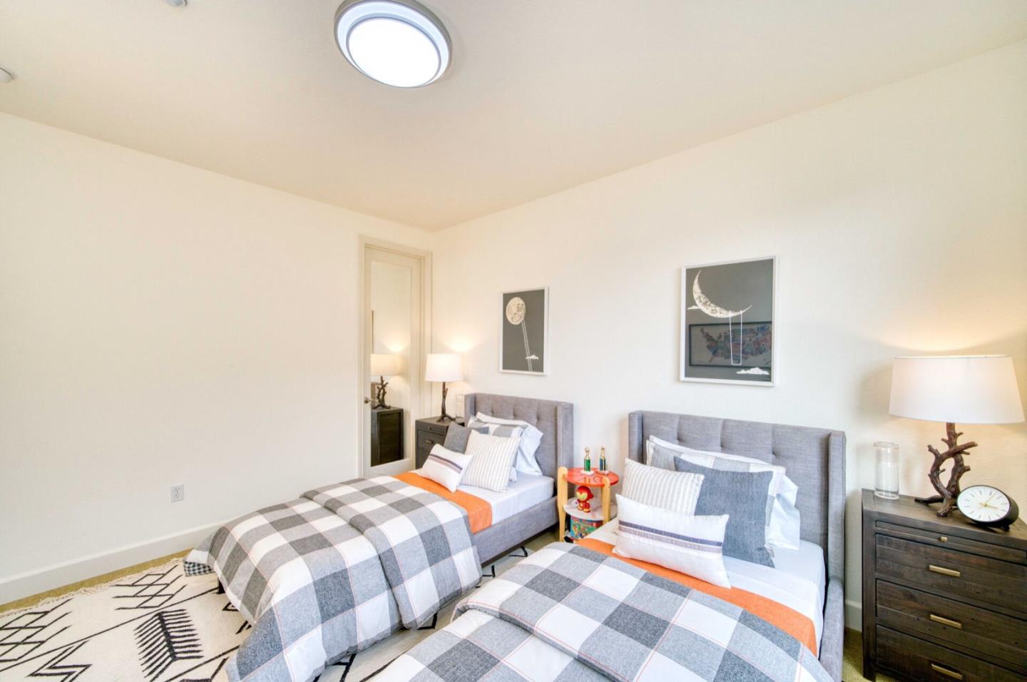 1 Connemara Drive Pacifica, CA 94044 - Photo 22 of 45 a bedroom with a bed and lamp with on the dresser