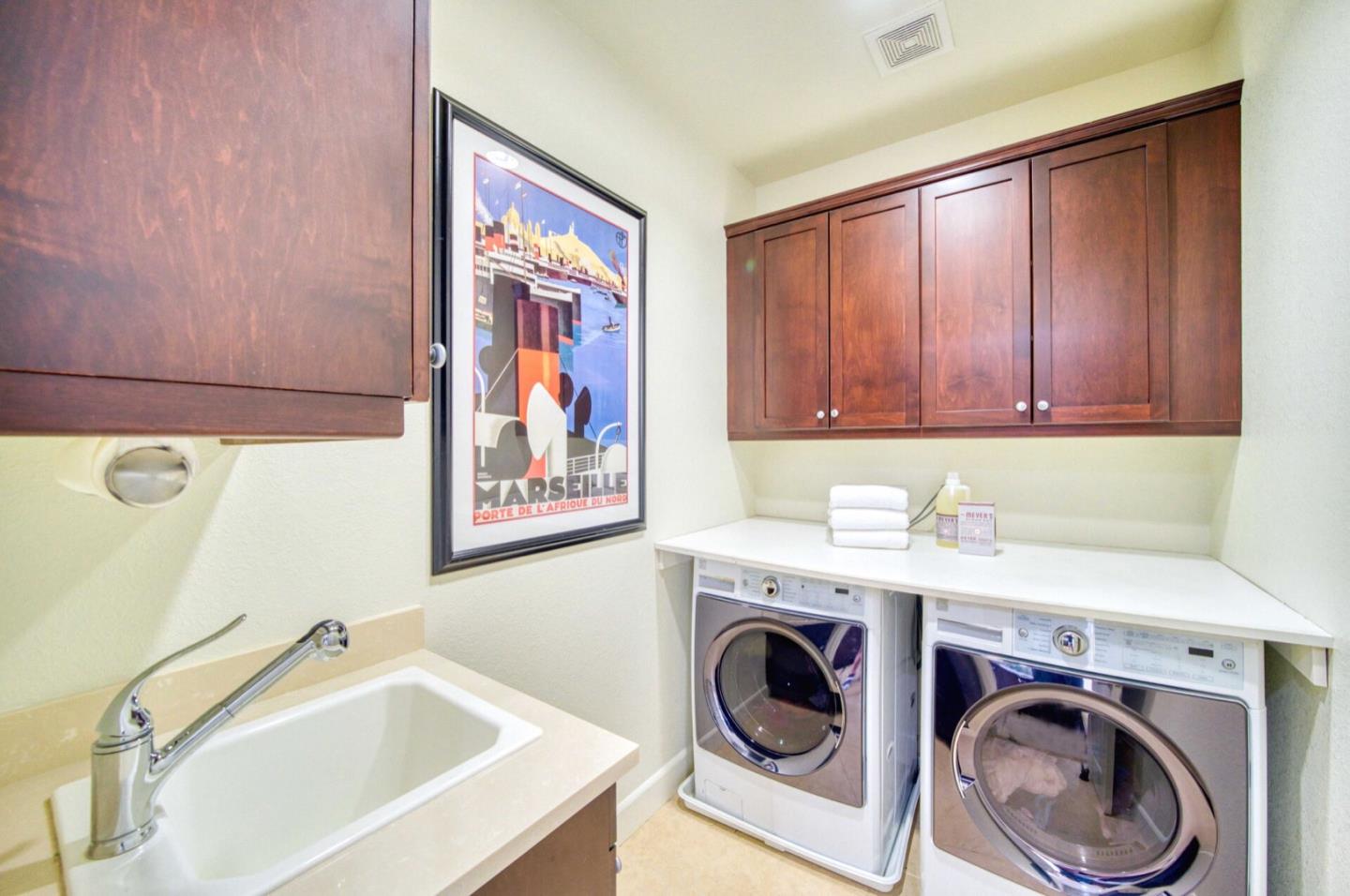 1 Connemara Drive Pacifica, CA 94044 - Photo 23 of 45 a utility room with a sink a washer and dryer