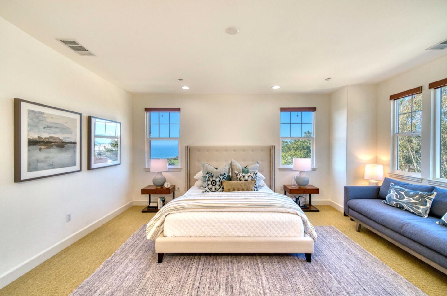 1 Connemara Drive Pacifica, CA 94044 - Photo 24 of 45 a bedroom with a bed couch and a large window