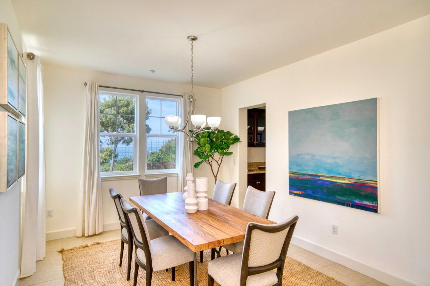 1 Connemara Drive Pacifica, CA 94044 - Photo 4 of 45 a view of a dining room with furniture window and wooden floor