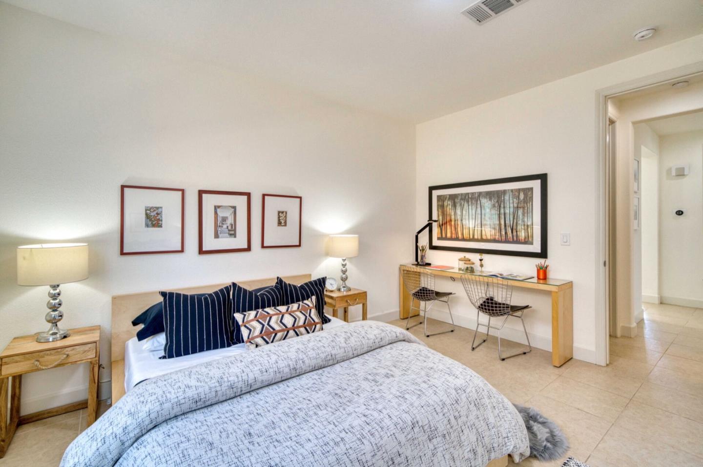 1 Connemara Drive Pacifica, CA 94044 - Photo 6 of 45 a bedroom with a bed and a lamp