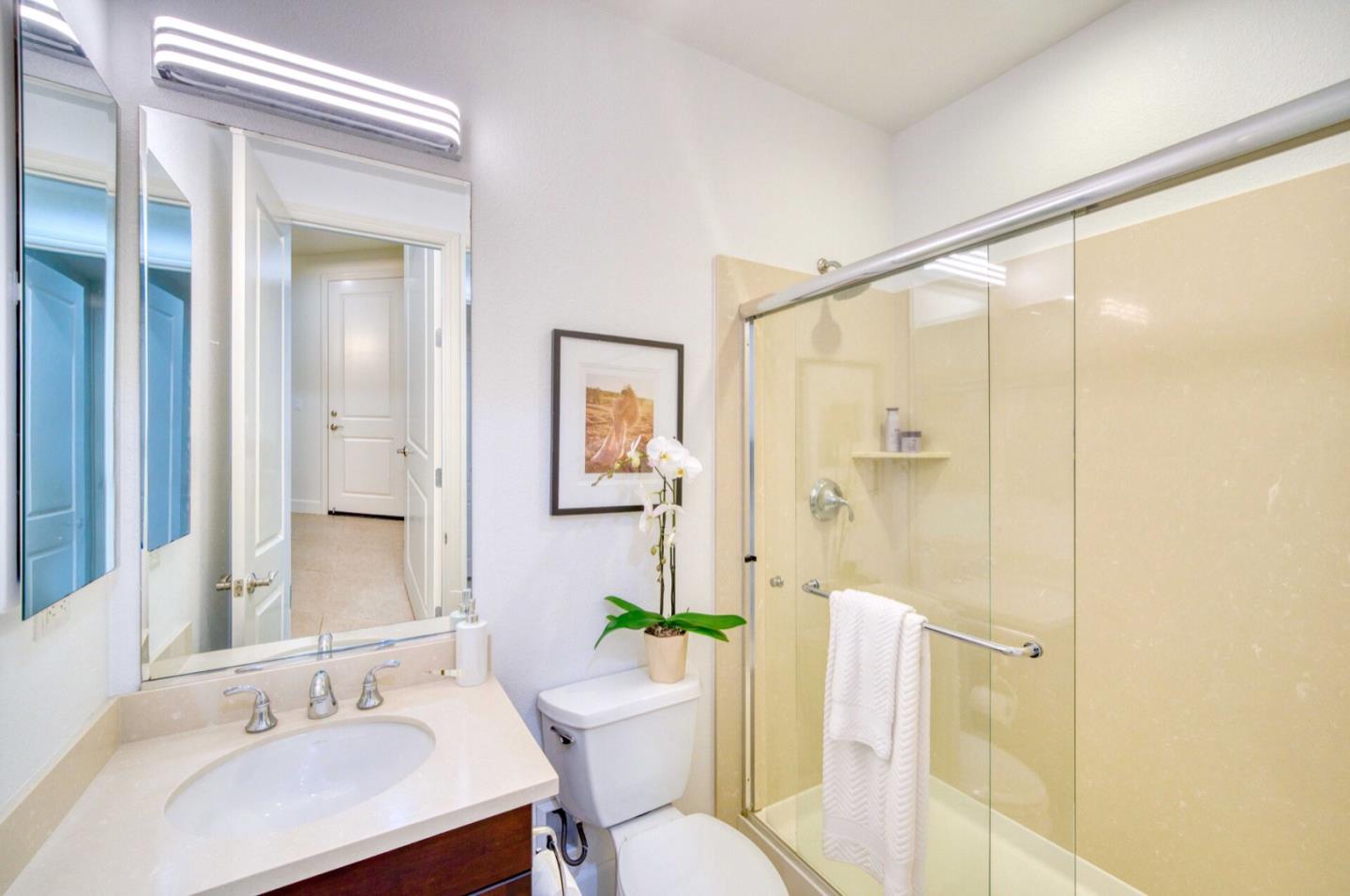 1 Connemara Drive Pacifica, CA 94044 - Photo 7 of 45 a bathroom with a sink and a mirror