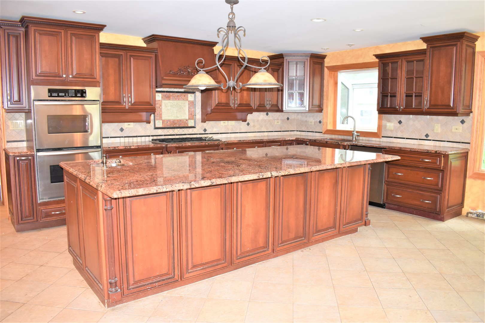 1441 Potter Road Park Ridge, IL 60068 - Photo 6 of 33 a kitchen with stainless steel appliances granite countertop a stove a sink and a microwave