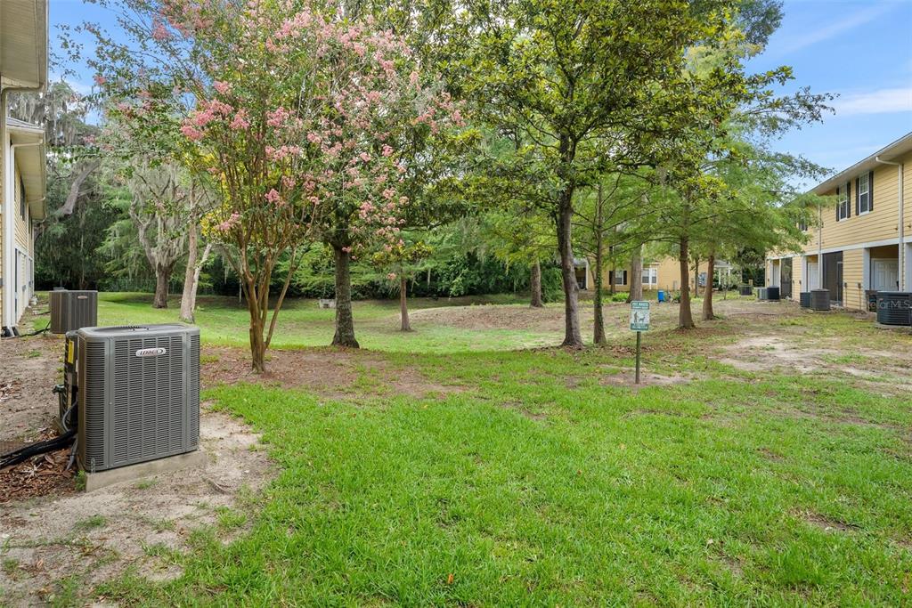 2927 Southwest 35th Place, Unit 113 Gainesville, FL 32608 - Photo 22 of 27 a view of a park with a tree