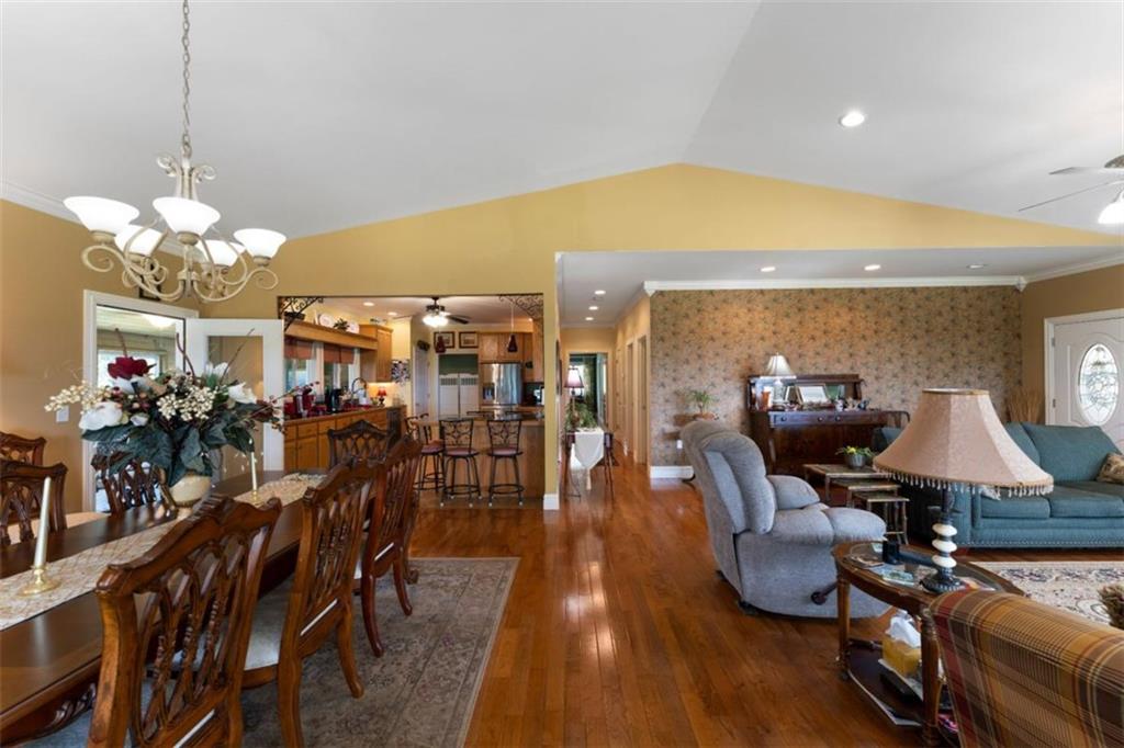 300 Ellis Road Southeast Rome, GA 30161 - Photo 12 of 46 a view of a dining room with furniture wooden floor and chandelier