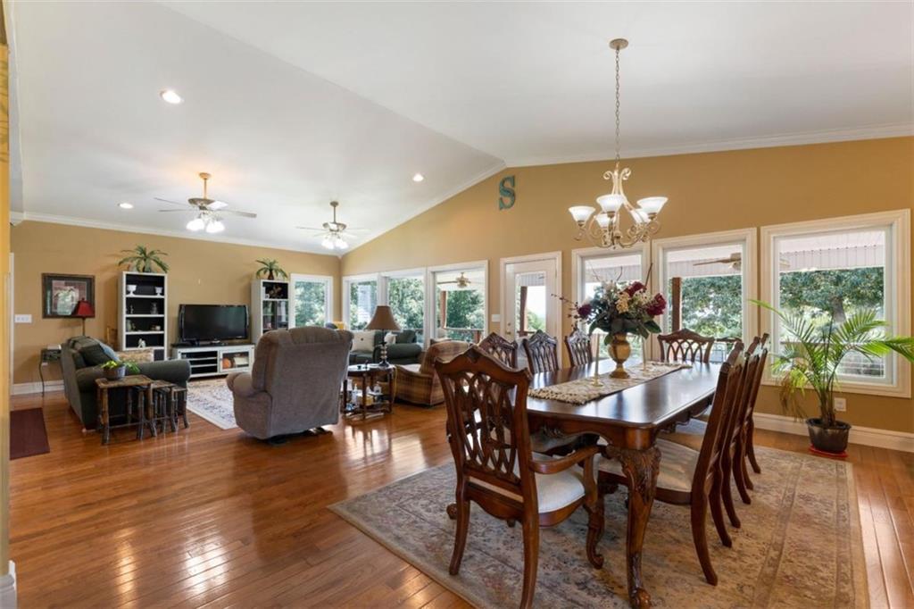 300 Ellis Road Southeast Rome, GA 30161 - Photo 14 of 46 a view of a dining room and livingroom with furniture wooden floor a chandelier