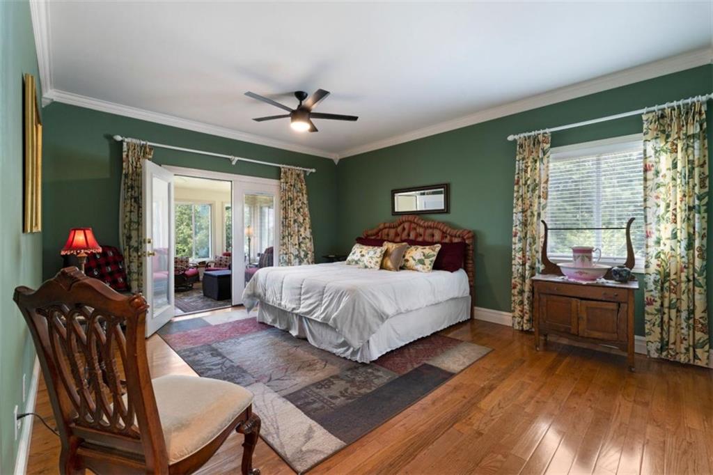 300 Ellis Road Southeast Rome, GA 30161 - Photo 24 of 46 a bedroom with a bed and wooden floor