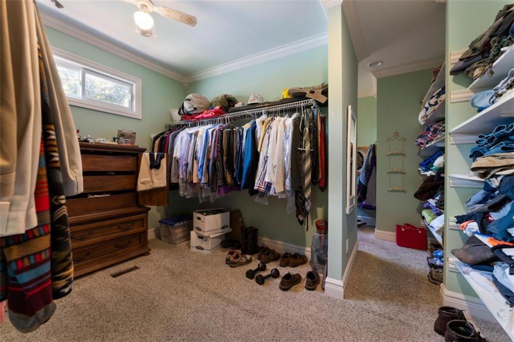 300 Ellis Road Southeast Rome, GA 30161 - Photo 27 of 46 a view of walk in closet with clothes and shoes