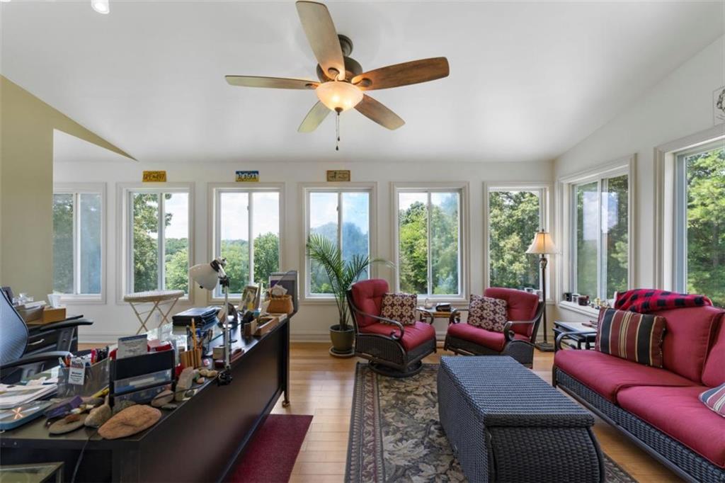 300 Ellis Road Southeast Rome, GA 30161 - Photo 28 of 46 a living room with furniture ceiling fan and a large window