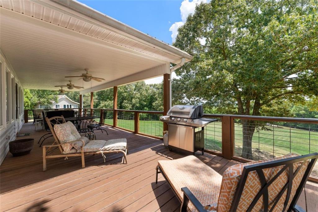300 Ellis Road Southeast Rome, GA 30161 - Photo 32 of 46 a view of a patio with a table chairs and wooden floor