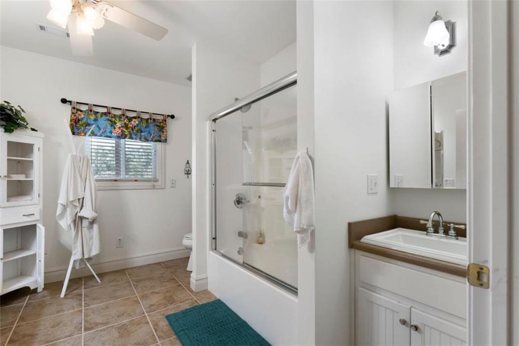 300 Ellis Road Southeast Rome, GA 30161 - Photo 41 of 46 a bathroom with a shower sink and mirror