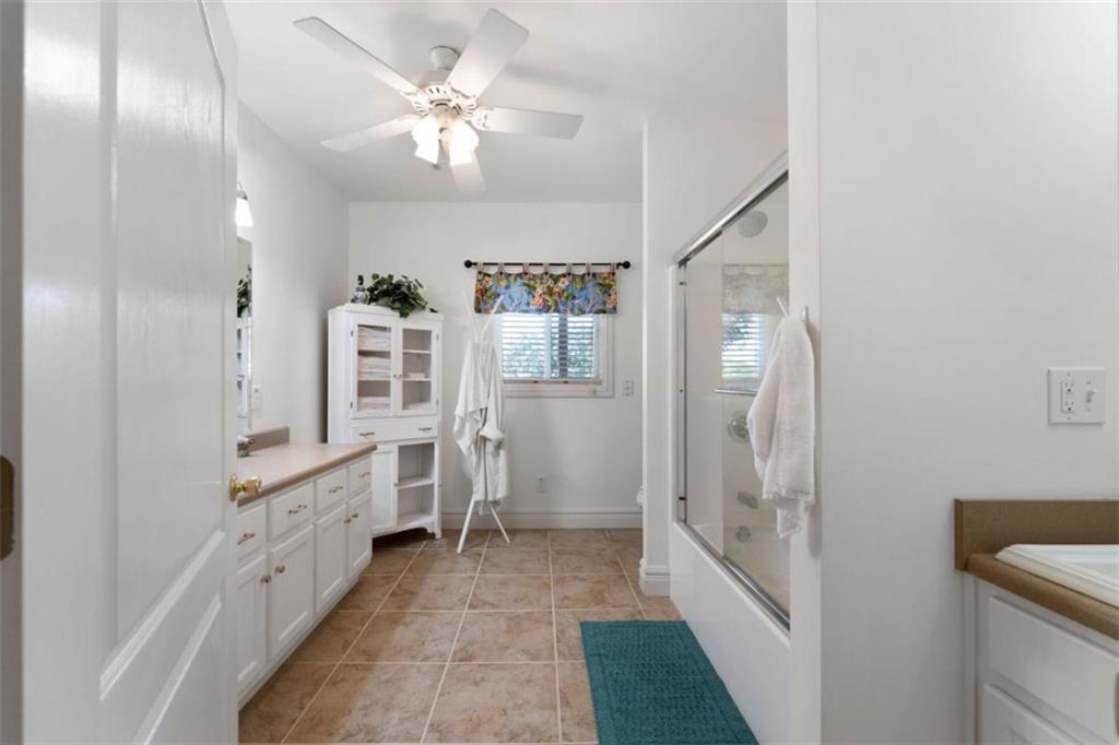 300 Ellis Road Southeast Rome, GA 30161 - Photo 42 of 46 a bathroom with a double vanity sink a toilet and shower