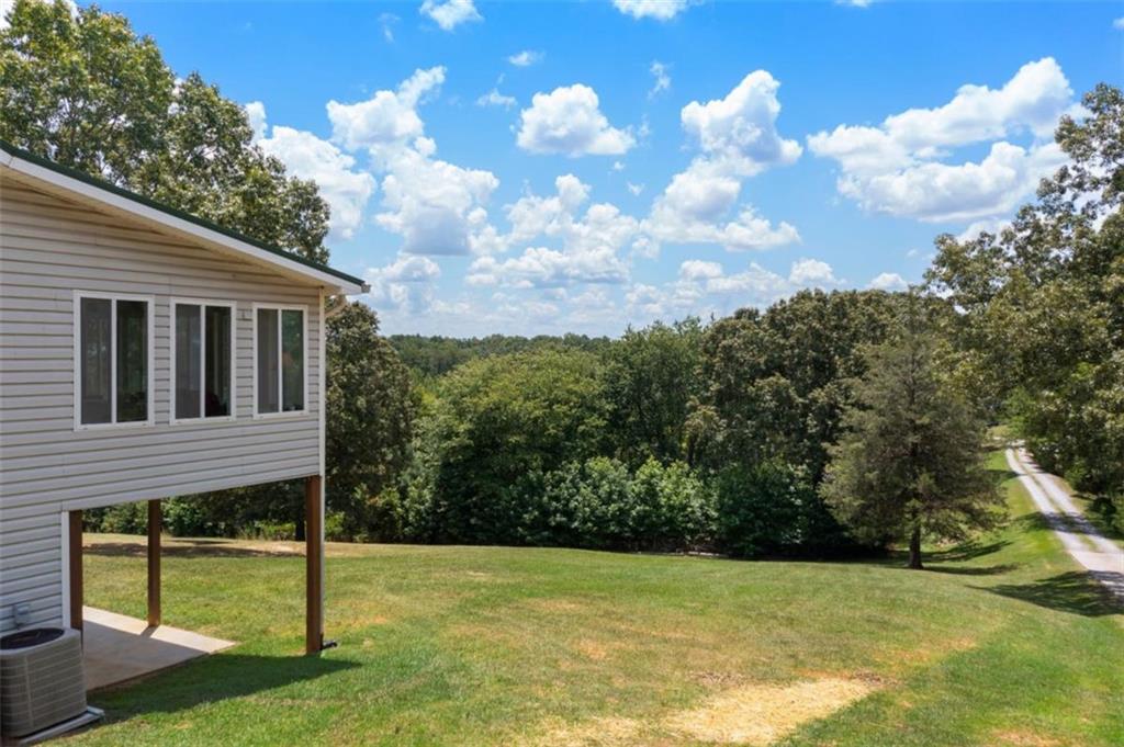 300 Ellis Road Southeast Rome, GA 30161 - Photo 6 of 46 a view of a house with backyard and a tree