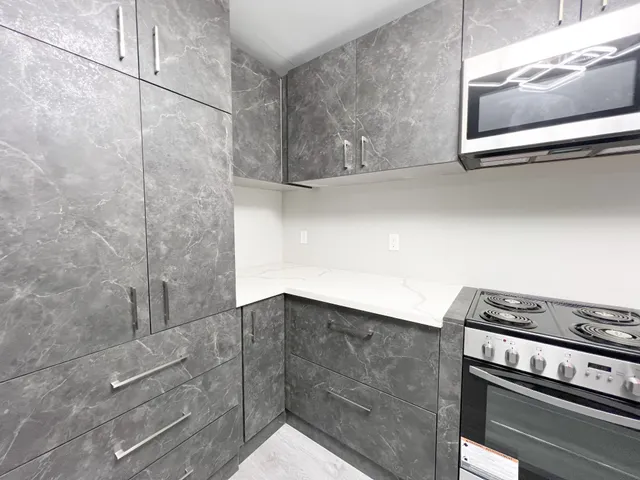 a kitchen with a stove and a microwave