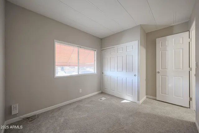 an empty room with windows