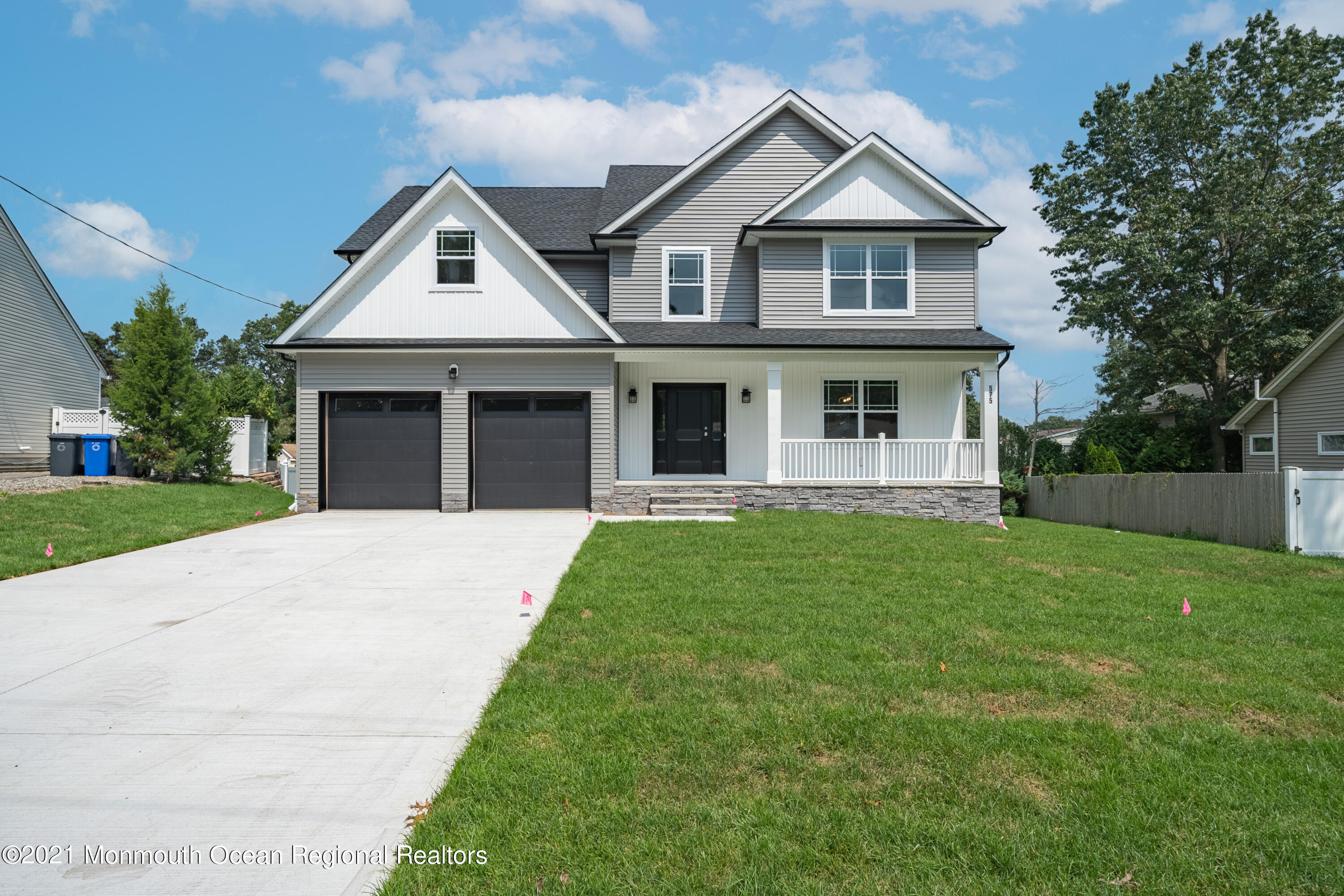 104 Launch Road Manahawkin, NJ 08050 - Photo 1 of 1 a front view of a house with a yard and garage