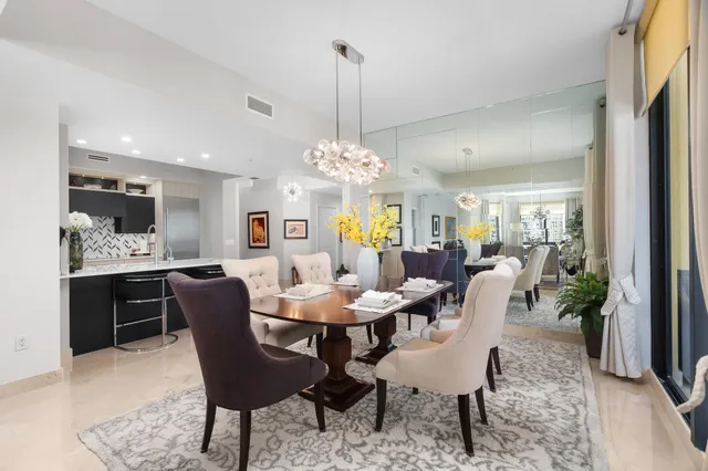 a kitchen with kitchen island granite countertop a sink and cabinets