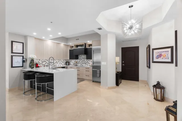 a kitchen with stainless steel appliances a stove and a refrigerator