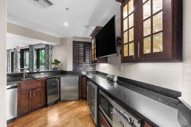 a swimming pool with outdoor seating and yard