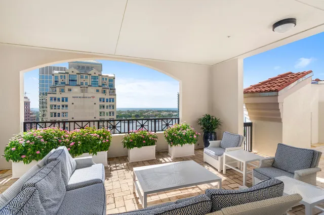 a swimming pool with outdoor seating and yard