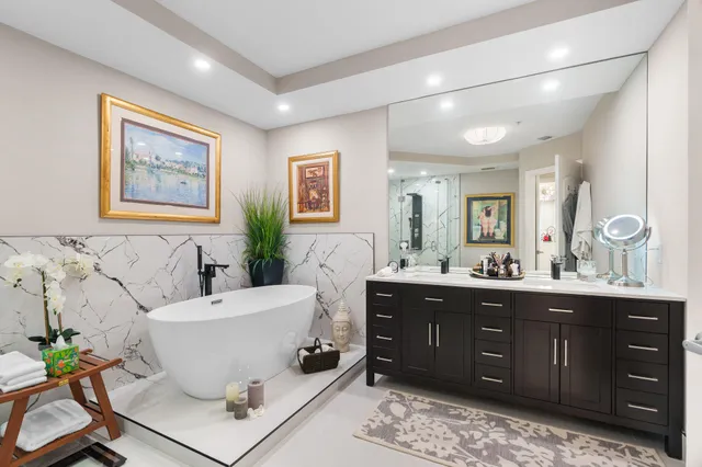 a living room with a couch and a potted plant