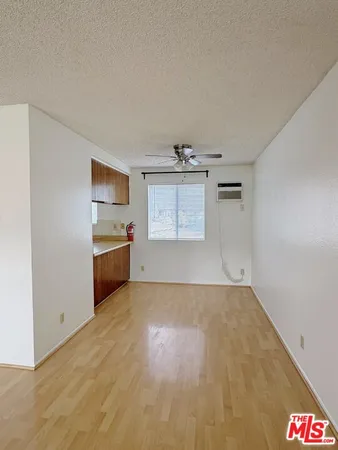 a view of a kitchen with a sink cabinets and a window