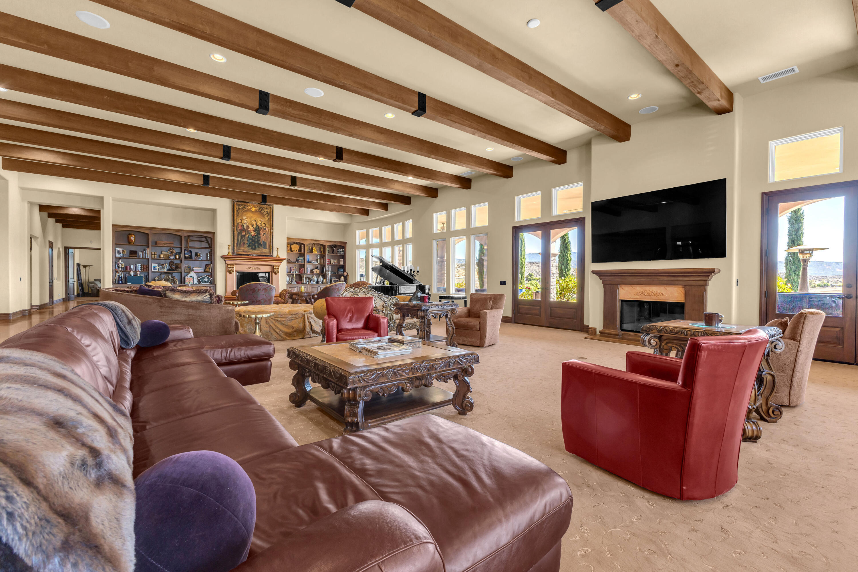 39345 San Ignacio Road Hemet, CA 92544 - Photo 19 of 110 a living room with furniture a flat screen tv and a fireplace