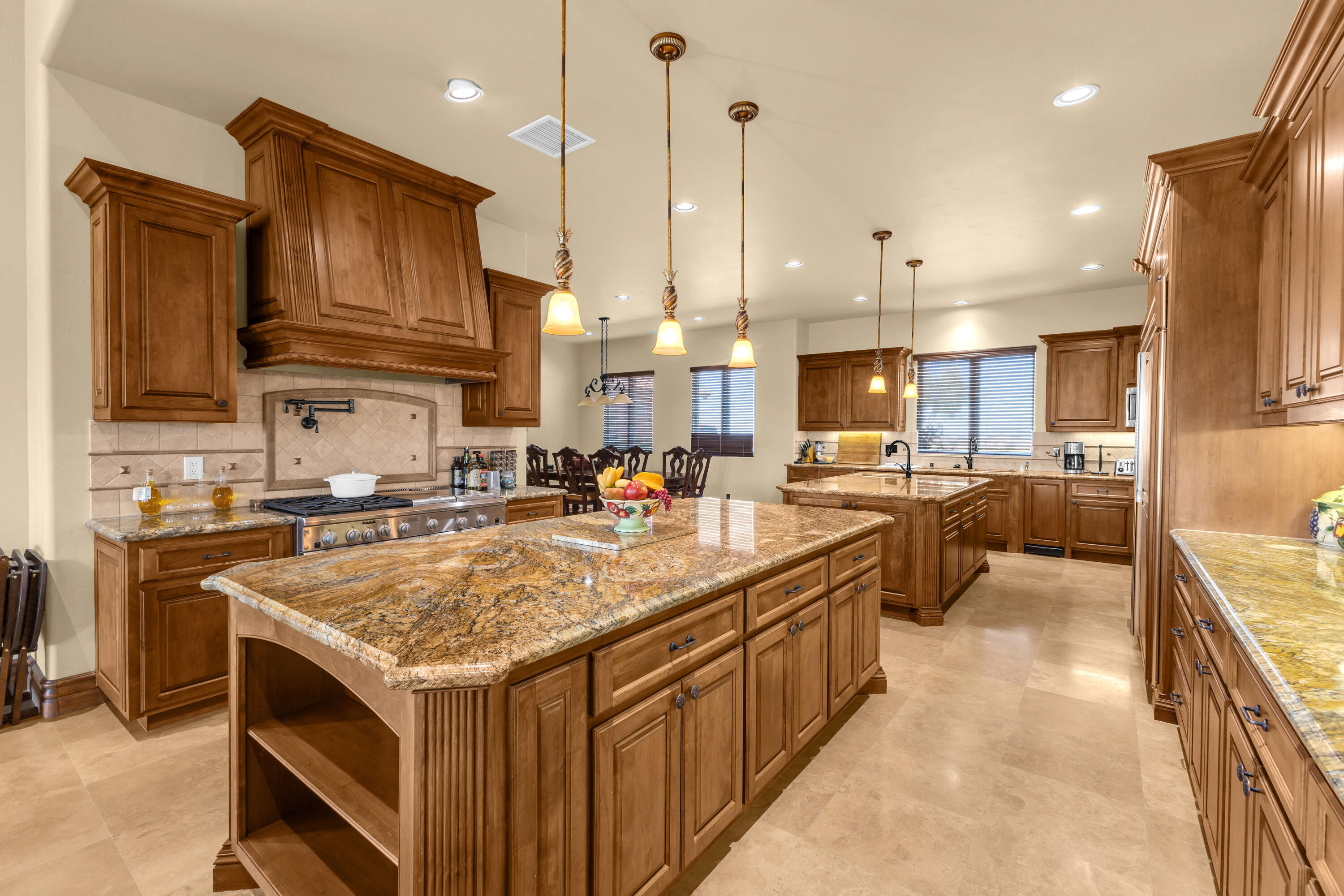 39345 San Ignacio Road Hemet, CA 92544 - Photo 25 of 110 a kitchen with stainless steel appliances granite countertop a kitchen island a stove a sink a oven and a refrigerator