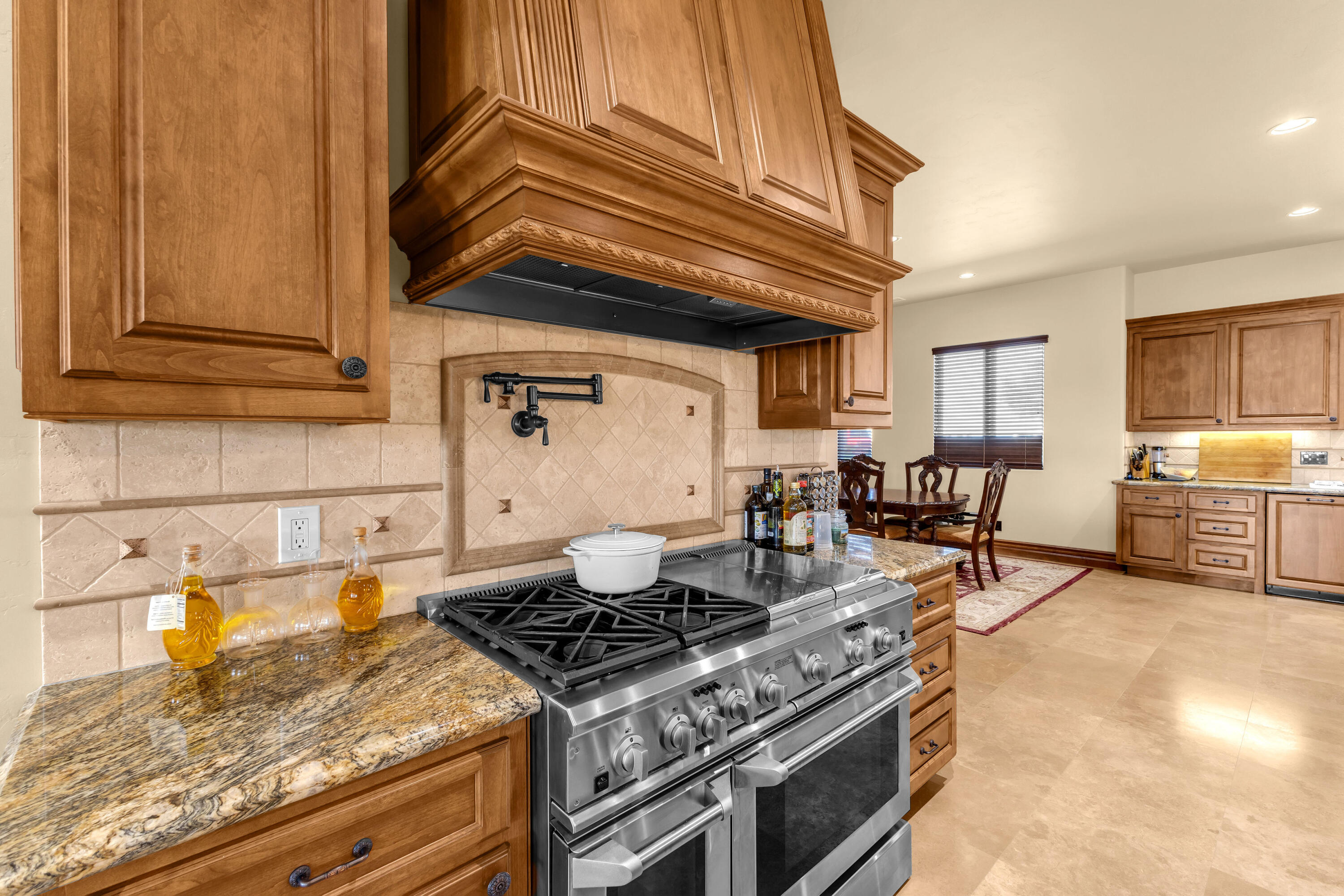 39345 San Ignacio Road Hemet, CA 92544 - Photo 26 of 110 a kitchen with a stove and a cabinet