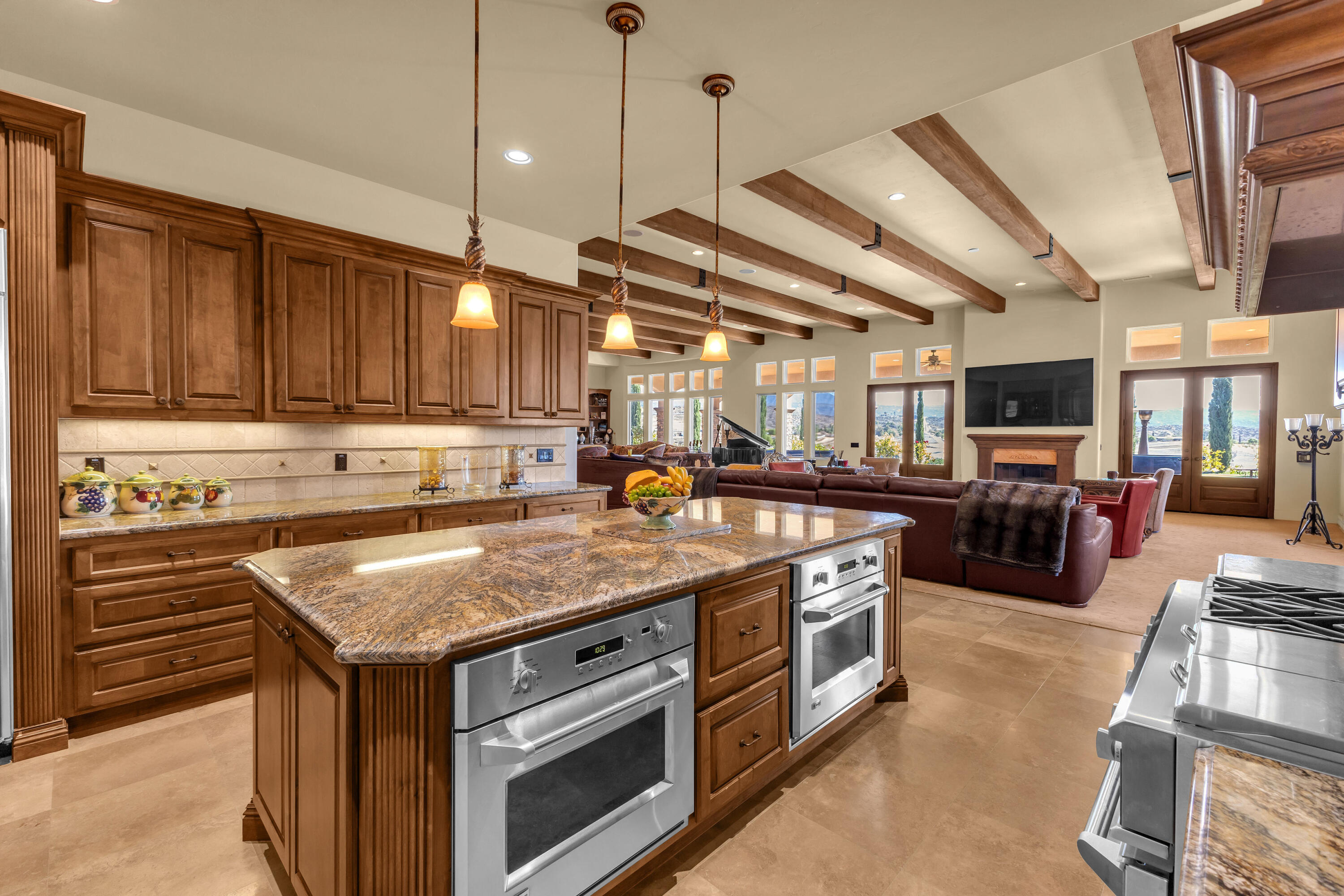 39345 San Ignacio Road Hemet, CA 92544 - Photo 28 of 110 a kitchen with stainless steel appliances granite countertop a stove and a sink with cabinets