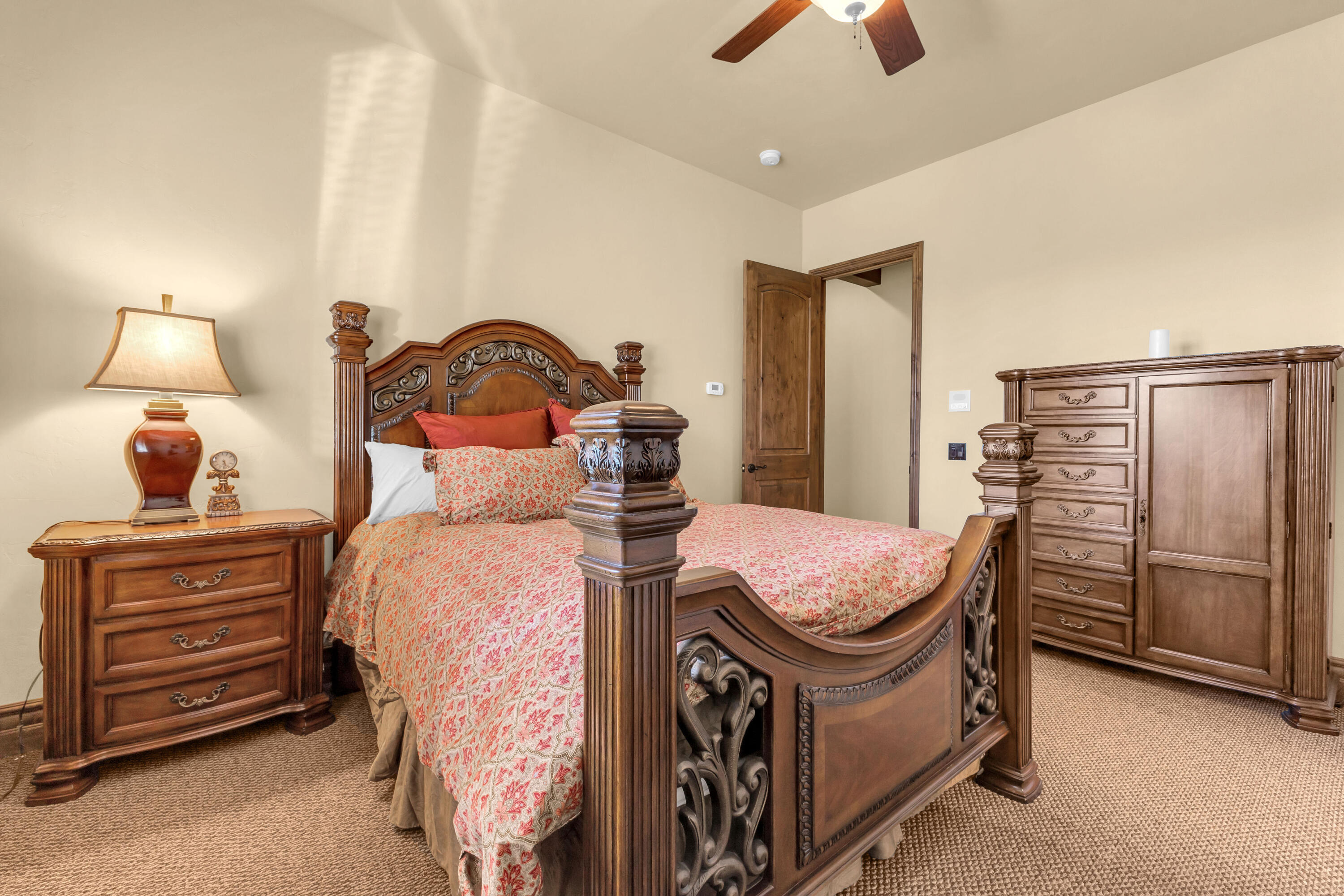 39345 San Ignacio Road Hemet, CA 92544 - Photo 62 of 110 a bed room with a bed and a chandelier