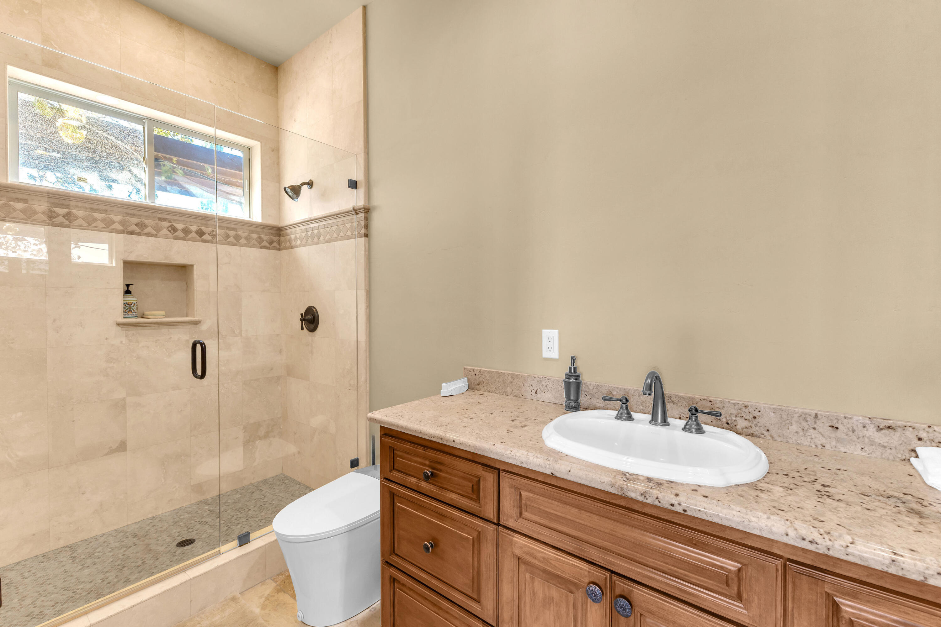39345 San Ignacio Road Hemet, CA 92544 - Photo 69 of 110 a bathroom with a granite countertop sink toilet and shower