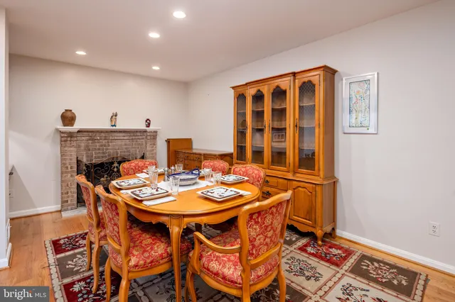 a outdoor dining space with furniture and wooden floor