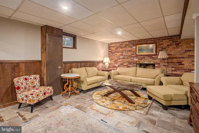 a living room with furniture and a rug