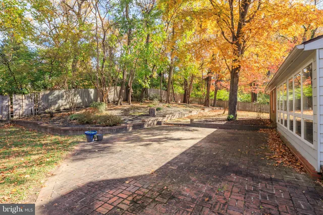 a view of a yard with swimming pool and sitting area
