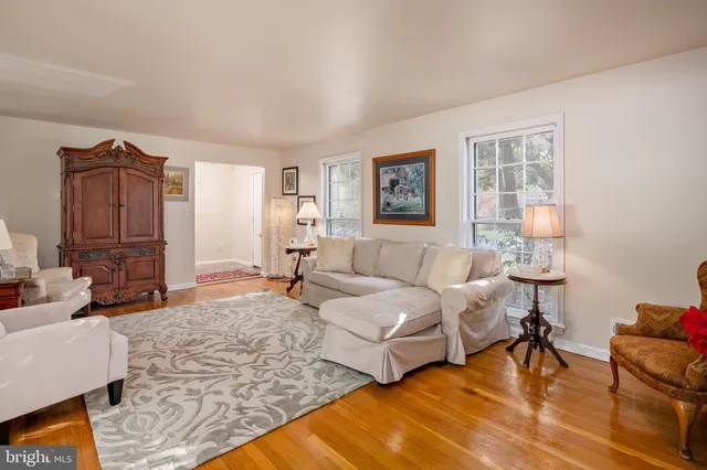 a spacious bedroom with two beds and a couch