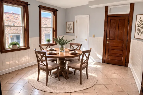a dining room with furniture and window