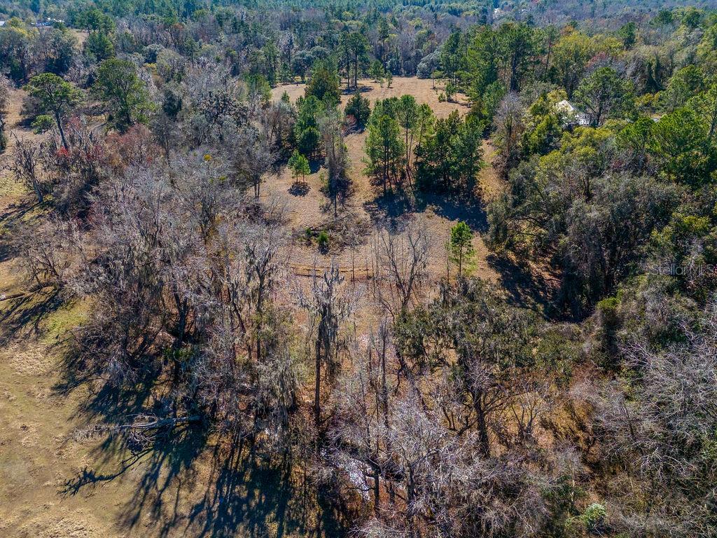 Tbd Northwest 99th Avenue Lake Butler, FL 32054 - Photo 14 of 19 a view of a lake with a house