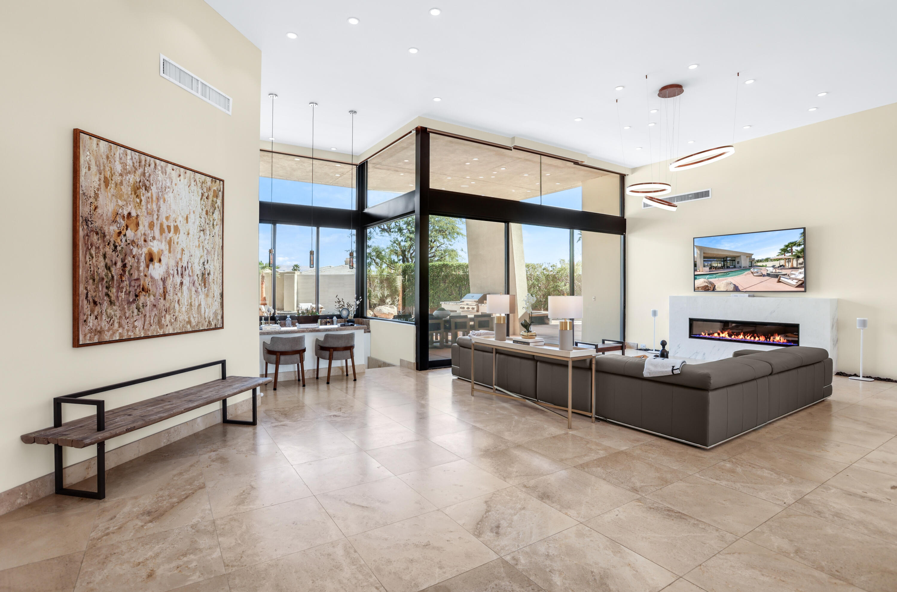 1 Seclude Court Rancho Mirage, CA 92270 - Photo 12 of 52 a living room with furniture and large windows