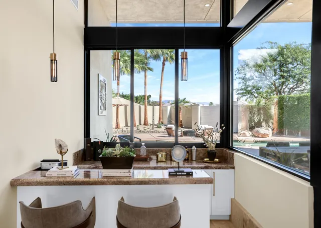 a dinning table and chairs in a room