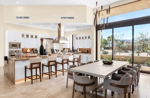 a view of a dining room with furniture window and outside view