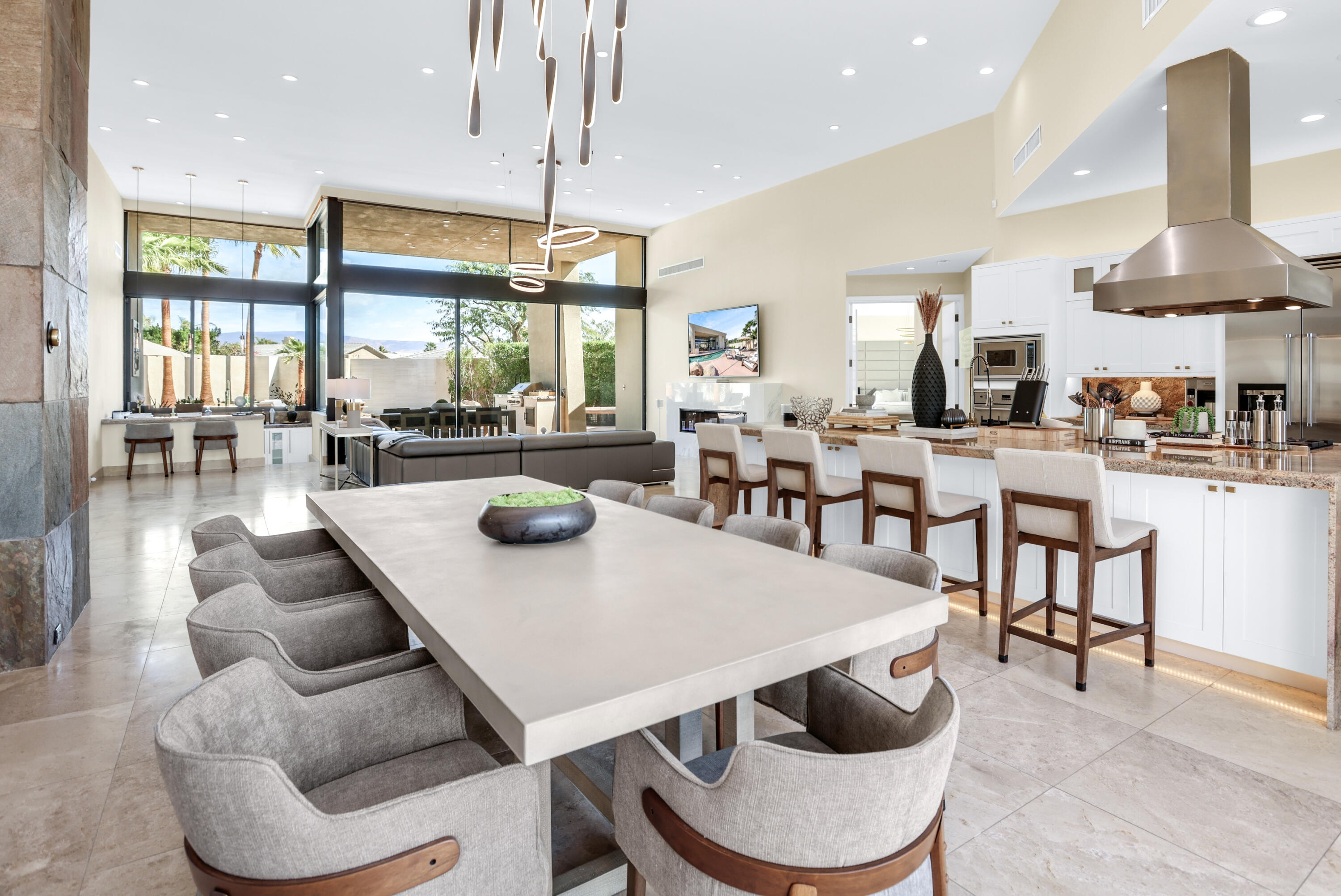 1 Seclude Court Rancho Mirage, CA 92270 - Photo 19 of 52 a view of a dining room with furniture window and outside view