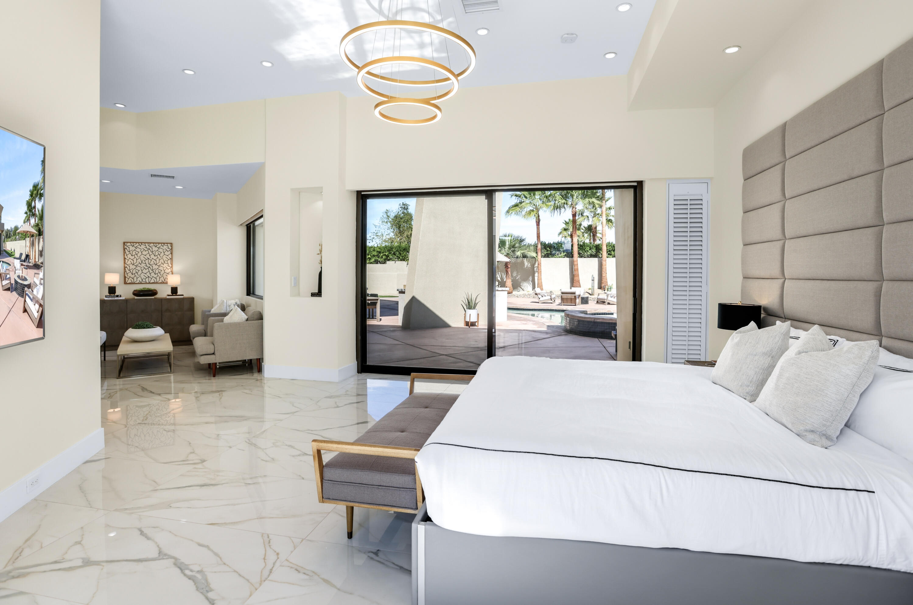 1 Seclude Court Rancho Mirage, CA 92270 - Photo 26 of 52 a bedroom with a bed and large windows