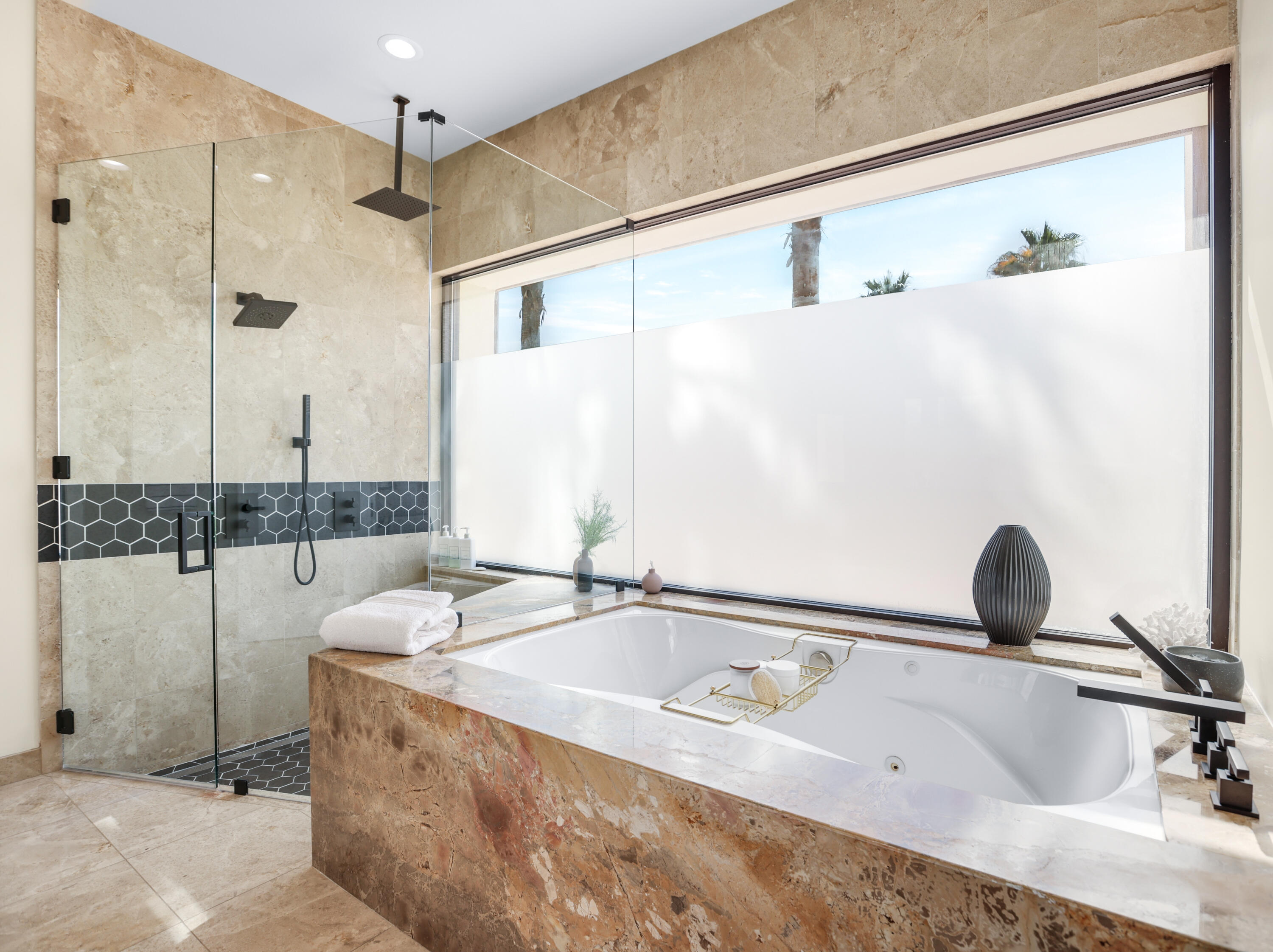 1 Seclude Court Rancho Mirage, CA 92270 - Photo 28 of 52 a bathroom with a tub sink and mirror